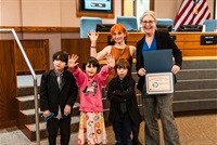 Wendi Strom posing with Amber Varwig and three children