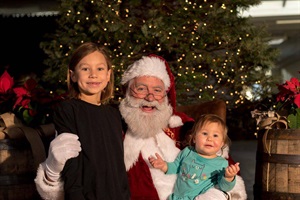 Santa posing with children