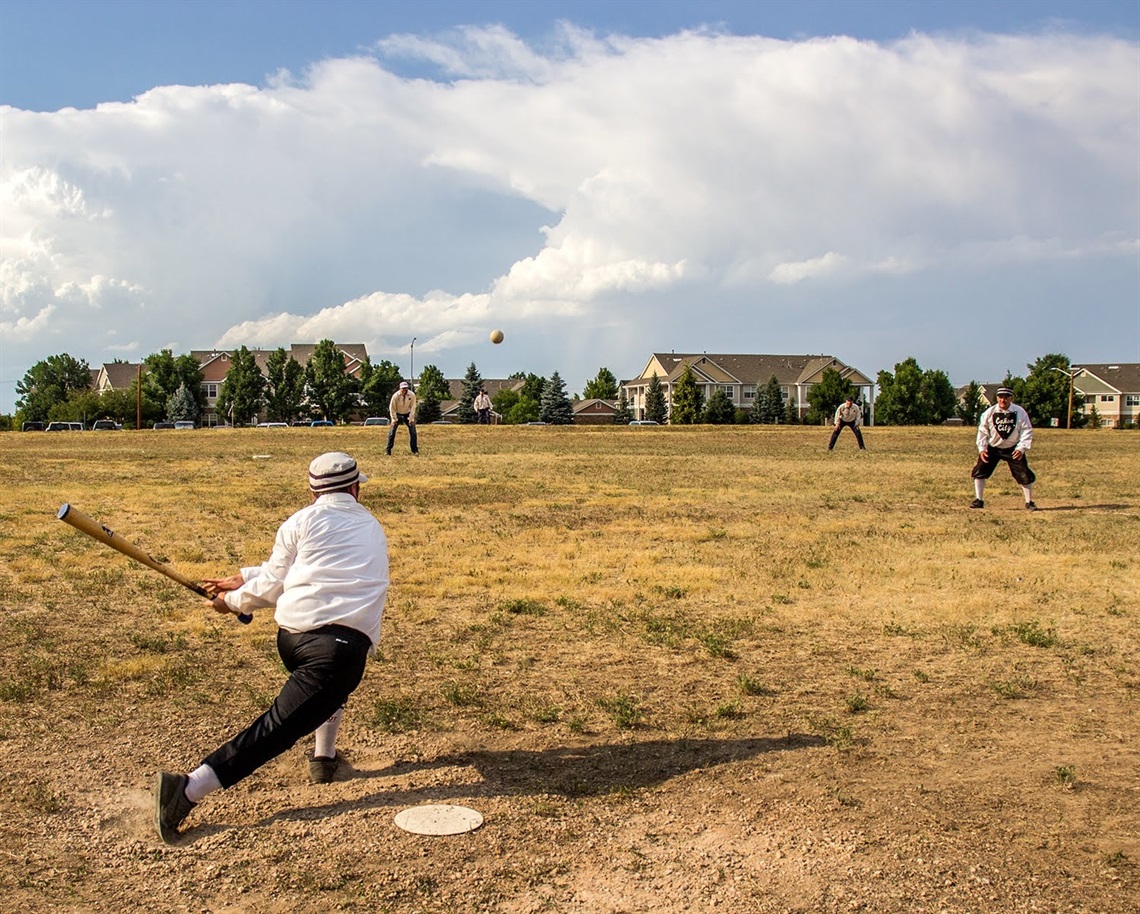 A base ball game is played in a field.