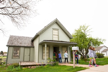 Kids exiting a historical home