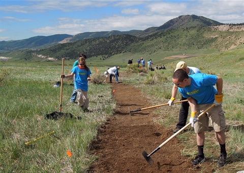 National Trails Day volunteers landscape a trail in Bear Creek Lake Park.