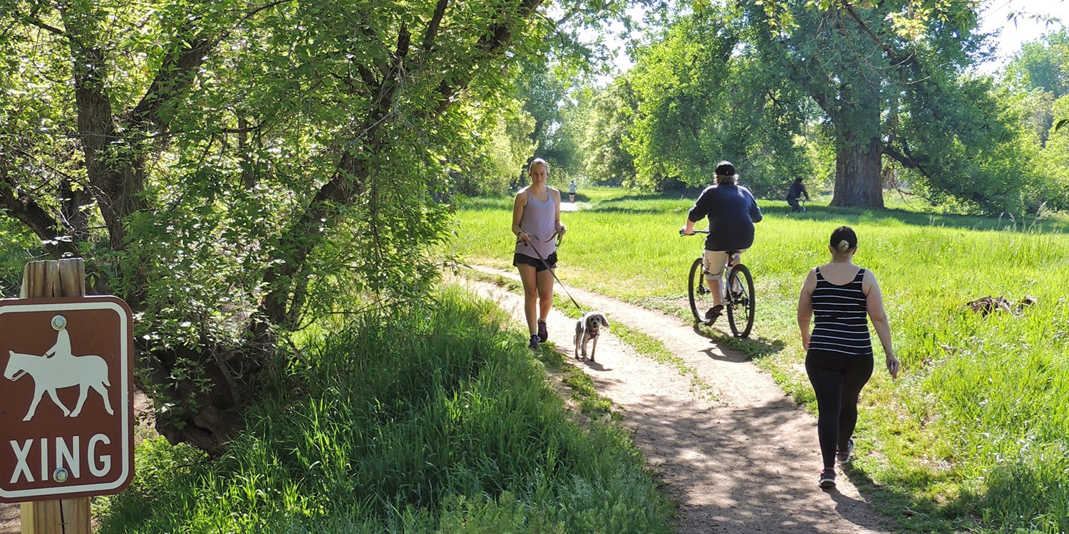 Bikers and hikers use a trail.