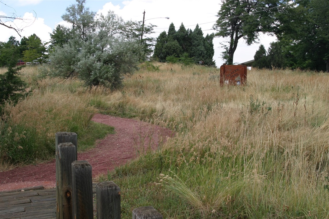 Graham Park with walking trail and park sign