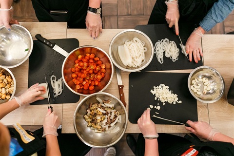 hands grabbing ingredients