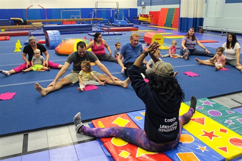 A gymnastics class takes place in the Link gymnasium.