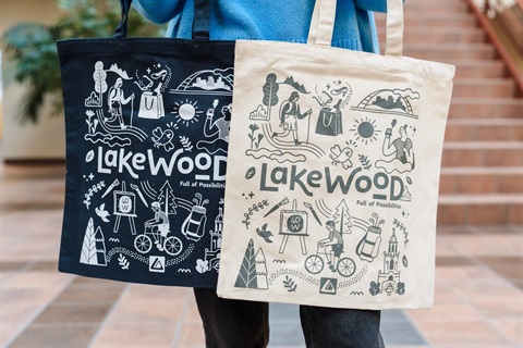 A blue Lakewood shopping bag and a white Lakewood shopping bag