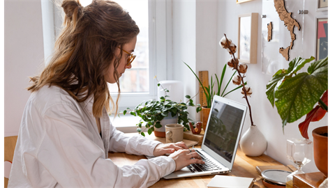 woman typing at a computer