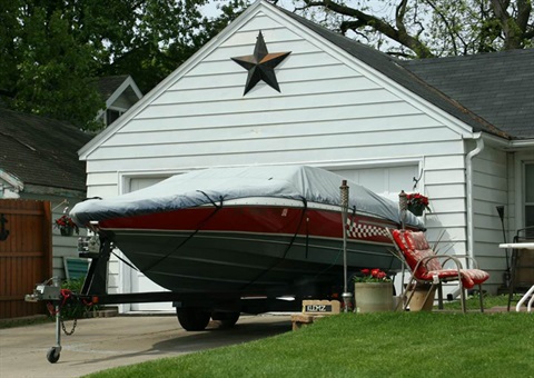 Boat trailer in a driveway.