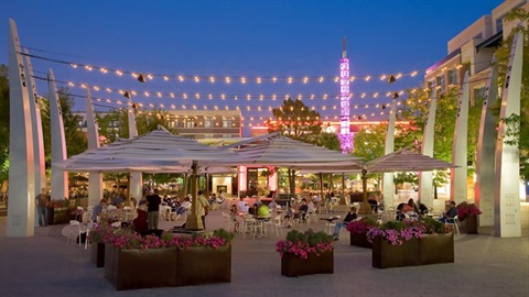 Outdoors with lights and tents and tables