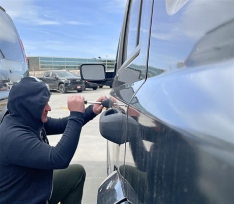 Man trying to break into car