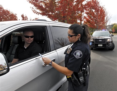 Police Agent giving a traffic citation.